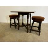 Small pub dominoes table and two upholstered bar stools