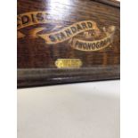 An Edison Standard Phonograph, black japanned metal with aluminium horn and oak case, with
