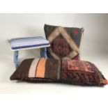 Two vintage carpet cushions with a wooden painted footstoll