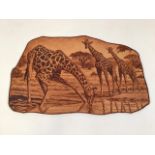 A pyrography scene on leather of giraffes by Hendrick Vrey. 2001