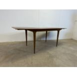 A. H. McIntosh & Co. of Kirkcaldy mid century teak extending table. W:152cm x D:92cm x H:74cmW: