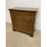 A late Victorian-Edwardian stained pine chest of drawers with original back.