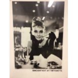 Two framed prints. Audrey Hepburn as Holly Golightly in Breakfast at Tiffany's and the knock out