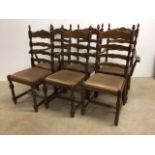 Set of six oak ladder back chairs to include two carvers.