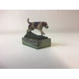 A small cold painted Vienna bronze of a hunting dog on green onyx base. Stamped AJM