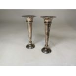 A pair of sterling silver trumpet vases with weighted bases by Charles S Green & Co Ltd, Birmingham.