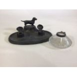 A pewter inkwell with dachshund and a white metal topped inkwell.
