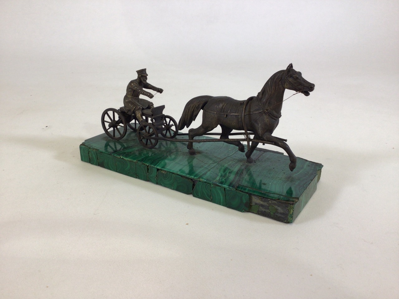 A late 19th/early 20th century Russian bronze group modelled as a horse drawn sled