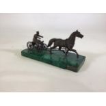 A late 19th/early 20th century Russian bronze group modelled as a horse drawn sled