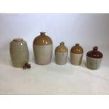 A collection of four stoneware flagons and a Moira pottery wine flagon. Bristol, Exeter and Glasgow.