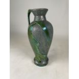 An Austrian Art Nouveau Ewer/Vase, with iridescent green leaf design over a textured surface