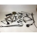 A assortment of horse riding equipment and other metal items. Together with a brass bed pan.