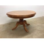 A heavy pine circular table. W:120cm x D:120cm x H:75cm