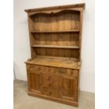 A small pine country kitchen dresser. W:119cm x D:49cm x H:192cm