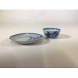 A Nanking Cargo cup and saucer. Chips to rim of saucer. Hairline crack alongside small chip to