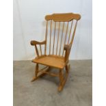 A modern Ercol style rocking chair.W:57cm x D:77cm x H:105cm