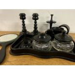 A collection of ebonised desk top items.