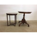 A circular walnut veneered tripod table on turned pedestal with quadrapod base also with another