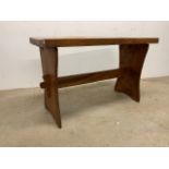 A pine pub table with curved top W:103.4cm x D:47cm x H:65cm