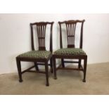 A pair of late Victorian oak dining chairs with drop in seats.W:54cm x D:40cm x H:97cm