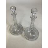A pair of late 19th early 20th century cut glass onion shaped decanters with etched greek key design
