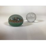 A good quality 20th century glass paperweight with millefiore canes, together with a clear glass