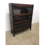 A Globe Wernike three section oak bookcase with leaded glass and Globe Wernike stamp.W:87cm x D: