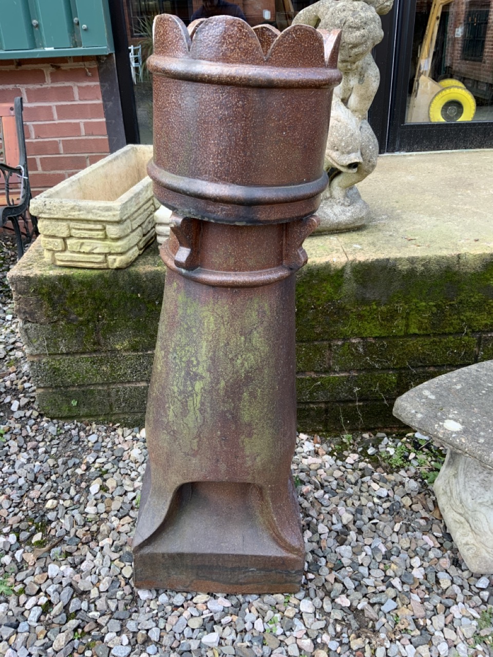 A large glazed chimney pot.W:40cm x D:40cm x H:119cm