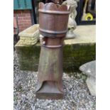 A large glazed chimney pot.W:40cm x D:40cm x H:119cm