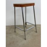 A 1970â€™s stool with metal legs and vinyl seat.W:36cm x D:29cm x H:62cm