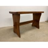A pine pub table with curved top W:103.4cm x D:47cm x H:65cm