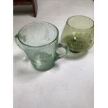 Two etched green glass bowls. 14cm(h) 15cm(h). Indistinct signature to base.