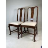 A pair of oak and mahogany dining chairs with upholstered seats. W:48cm x D:49cm x H:97cm