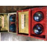 Two pairs of Chinese musical iron ball direction to include a cloisonnÃ© example. Both boxed.