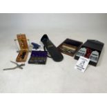 A collection of technical instruments, boxed scales and electrical watch testing tools.