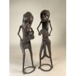 A pair of Benin style West African cast metal figures. H:50cm