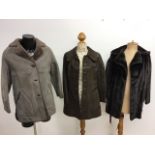 A 1970s sheepskin coat, a 1970s faux fur jacket and a 1960s suede leather trimmed coat.