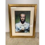 A signed and framed photo of David Beckham with certificate of authenticity