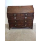 A Victorian mahogany bureau with pull out slides and drop down front to interior bureau with four