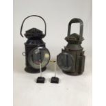 Two vintage railway lanterns. Black lantern: stamped SER. Together with two model signals for a