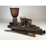 A collection of decorative ethnographical items to include African drums, Elephants and other