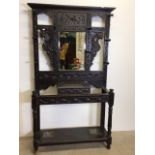 Victorian stained oak and pine hall stand with carved dragons and foliage central mirror with