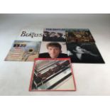 A selection of vinyl LPs to include The Beatles- Sgt Pepper Lonely Heart Club Band, Greatest Hits,