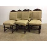 Set of six oak upholstered chairs with carved backs, barley twist legs and castors to front. W: