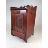 An art nouveau mahogany coal purdonium with with metal lined interior and coal shovel on brass