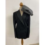 A mens dinner jacket by Montague Burton, London. With a pair of pinstripe trousers. Jacket: Chest