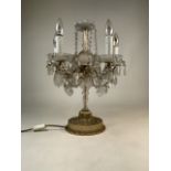 A five branch glass table candelabra with gilt metal base with cut glass drop lustres. W:40cm x D: