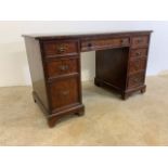 A mahogany leather topped pedestal desk. W:120cm x D:60cm x H:72cm