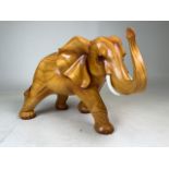 Wood effect model of an African elephant. W:40cm x D:20cm x H:25cm