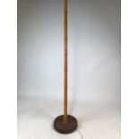 A simulated bamboo standard lamp in the style of Heals and Son. W:30cm x D:30cm x H:148cm